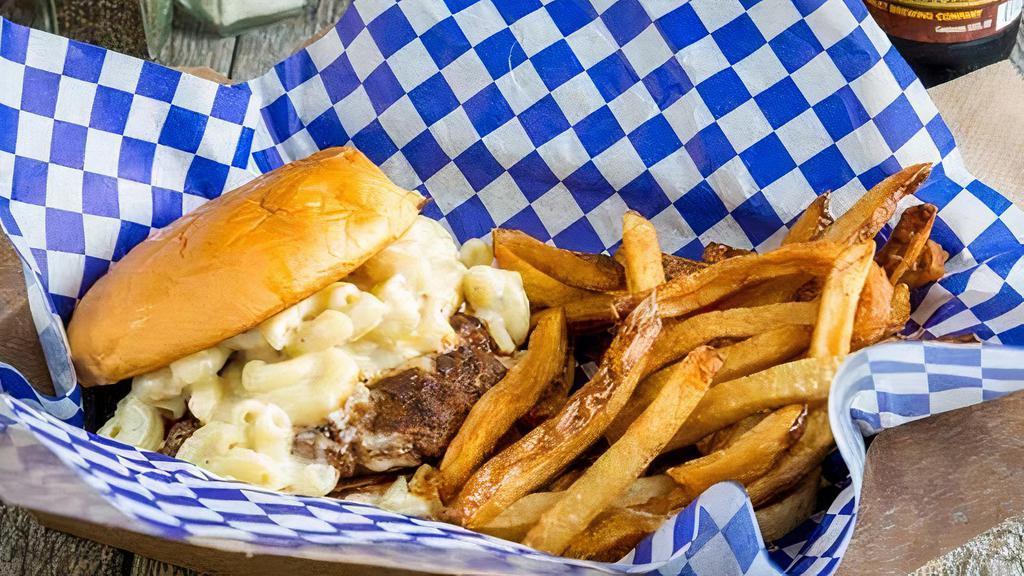 Mac Burger With Fries · 1/3 lb Certified Angus beef patty, on a toasted bun and smothered in original macaroni.