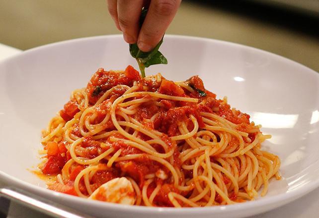 Spaghetti Crudaiola* · With tomato sauce, fresh tomatoes, fresh mozzarella, and basil.
