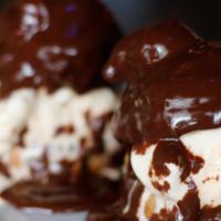 Profiteroles* · Cream puffs stuffed with vanilla ice cream and chocolate sauce.