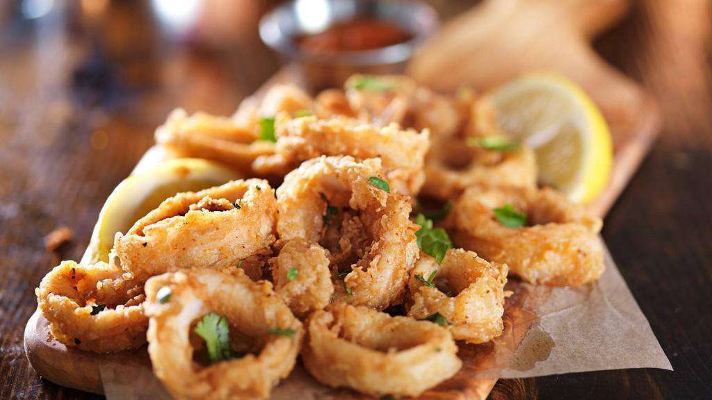 Crispy Calamari · Deliciously seasoned tender pieces of squid soaked in buttermilk, then coated in seasoned flour and deep-fried to golden-brown.