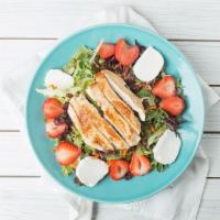 Bistro Salad · A mix of fresh baby salad greens topped with goat cheese, fresh strawberries, dried cranberr...
