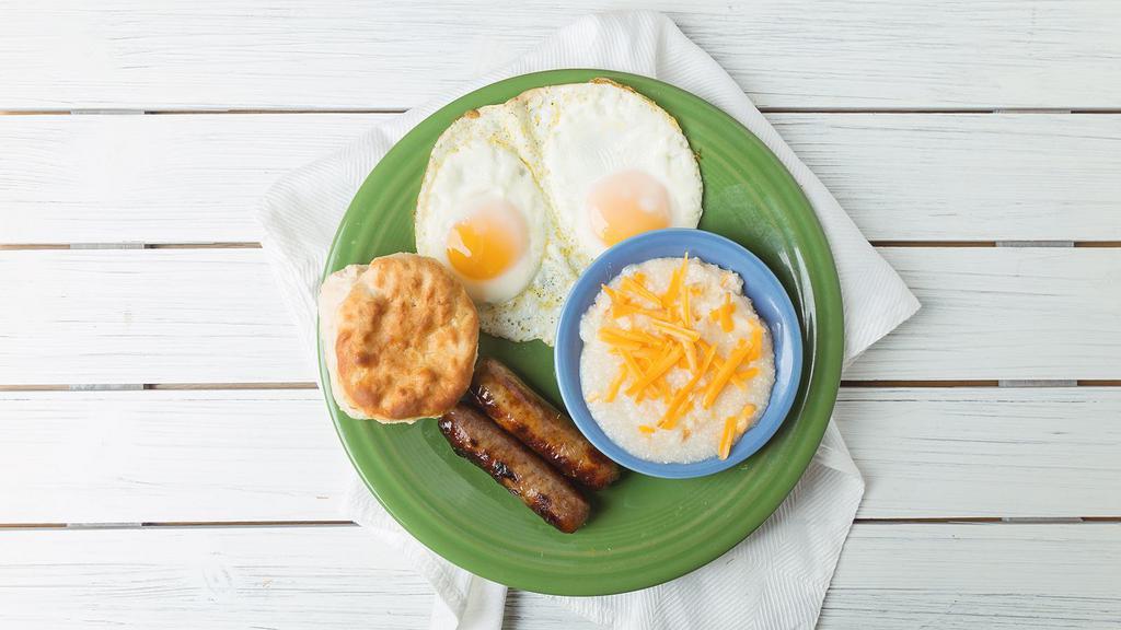 Sausage & Eggs · Two fresh eggs any style, two sausage links, creamy grits, and a flaky biscuit.