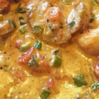 Shrimp & Grits (Bahamian Style) · Sauteed large shrimp infused with our very own goombay sauce that comes with cabbage.