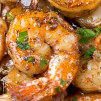 Calypso Sautéed Shrimp · Served with your choice of peas and rice or yellow rice and cabbage..