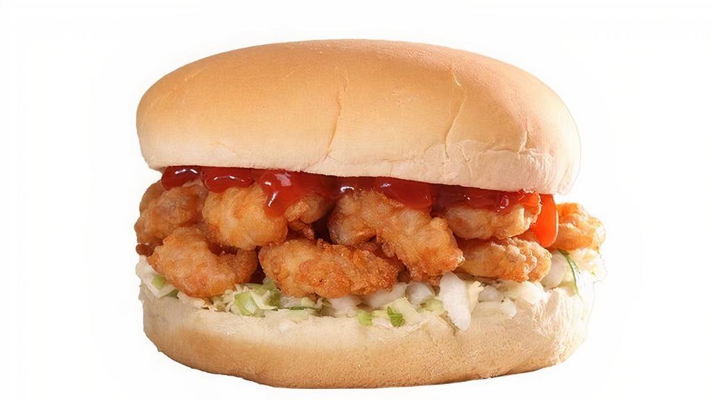 Big Shrimp Burger · Big version. A North Carolina coastal classic. Golden hand-breaded shrimp on a bed of slaw, topped with ketchup and served on a steamed bun.