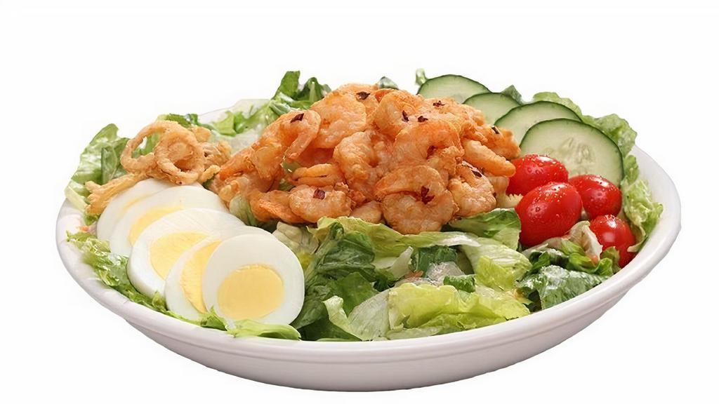 Spicy Shrimp Salad · Straight from the gulf coast. Mixed greens, red cabbage, cucumbers, sliced egg, shredded carrots, fried onion straws, cherry tomatoes, and spicy shrimp.