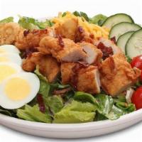  Cobb Salad · Mixed greens, red cabbage, shredded carrots, tomatoes, bacon, sliced egg, fried onion straws...