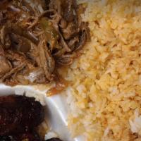 Carne Desmenuzada  · Shredded beef.  
Rice: Gallo pinto(rice and beans) or white rice
Side: sweet fried plantain ...