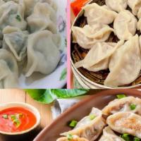 Chicken Dumplings - 鸡肉锅贴 · Albóndigas de pollo