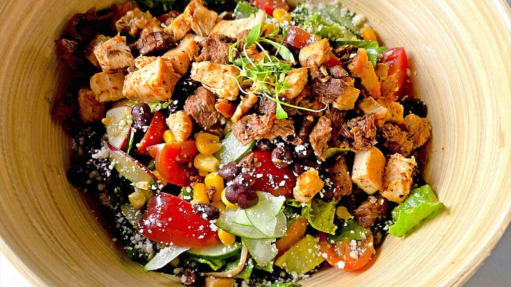 House Salad · Lettuce, tomato, avocado, radish, cucumber, roasted corn, cherry tomatoes, red onions, key lime baja vinaigrette. Add protein +$8