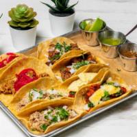 Fiesta Mexicana  · Includes: 
1 guacamole
1 esquites 
2 asada steak tacos 
2 pastor tacos 
2 cochinita pibil ta...