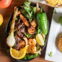 Grilled Steak, Chicken And Shrimp · Strips of tender steak, chicken, shrimp or veggies. Grilled and cooked with onions and bells...