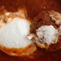 Meatballs Ricotta · Beef and pork meatballs in a tomato sauce topped with ricotta and Parmesan cheese.