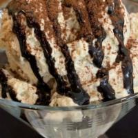 Homemade Tiramisu · Delicate mascarpone cheese and espresso mousse layered with ladyfinger cookies and topped wi...