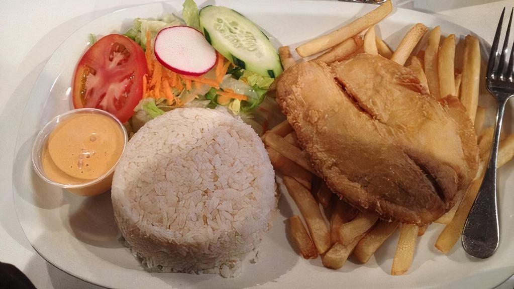 Filete De Pescado · Basa fish fillet served with your choice of rice and one side.