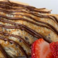 Nutella Crepe · Filled with Nutella and topped ice-cream with powdered sugar.