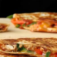 Chicken Quesadilla · grilled chicken  queso cheese peppers onion