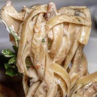 Jerk Chicken Pasta · Fettuccine pasta tossed in a spiced Alfredo sauce with bell peppers, tomatoes, and shredded ...