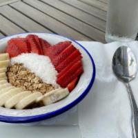 Organic Acai Bowl · Topped with organic granola, banana, strawberries, and coconut.