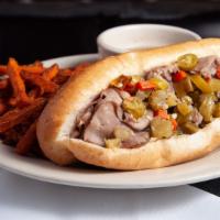 Chicago Italian Beef Sandwich · A hoagie roll piled high with our thinly sliced beef seasoned and simmered for hours.