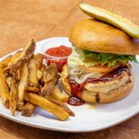 Bbq Chicken Sandwich · Served with pickles, cheese lettuce, tomato, onion, and fries.