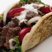 Gyro · Shaved roast lamb and beef with lettuce, tomato, onion & homemade tzatziki sauce.