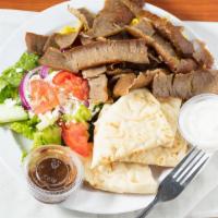 Gyro Plate · Shaved roast lamb & beef served over rice with a side greek salad & pita and homemade tzatzi...