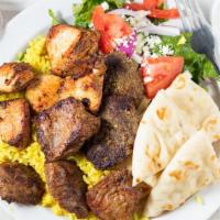 Mix Kabop Sampler Plate · Mixed chicken kabob, lamb kabob and kofta kabob over rice with a side greek salad, homemade ...