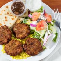 Falafel Plate · Fried ground chickpeas with herbs. Served over rice with a side greek salad & pita and tahin...