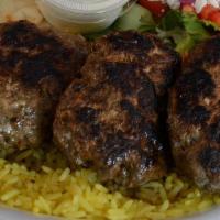 Kofta Kabop Plate · Broiled seasoned ground lamb over rice with a side greek salad and homemade tzatziki sauce &...
