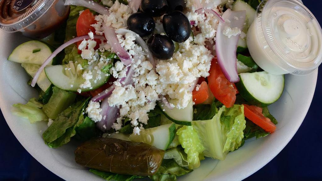 Greek Salad · Romaine & iceberg lettuce, tomatoes, cucumbers, olives, onions, stuffed grape leaf and feta cheese with greek balsamic dressing and pita bread.