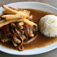 Pollo Saltado · wok seared chicken, soy and oyster sauce, onions, tomato petals, jasmine rice, fries