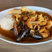 Pescado A Lo Macho · Traditional Peruvian crispy fish, shrimp,. calamari, mussels, slightly spicy creamy saucemad...