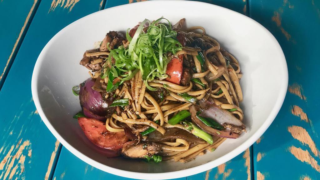 Tallarin Saltado · wok seared chicken, soy and oyster sauce, onions, tomato, ginger, linguini