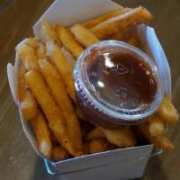 Basket Sesame Fries · Our world famous sesame fries, sweet, salty and add a little spicy w/ our chipotle ketchup.