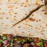 Grande Quesadilla · Chicken, ground beef, or steak on a soft flour tortilla, grilled to crispy perfection and se...