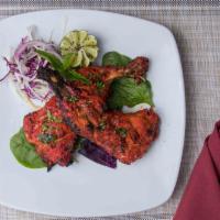 Tandoori Chicken (2 Leg Qtrs) · All tandoori dishes are marinated in a spicy sauce and cooked on skewer in tandoori clay ove...
