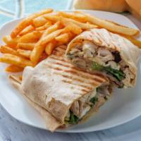 Garlic Parmesan
Chicken Wrap · Mouth-watering garlic parm tossed chicken with romaine lettuce, tomatoes, onions and cheese ...