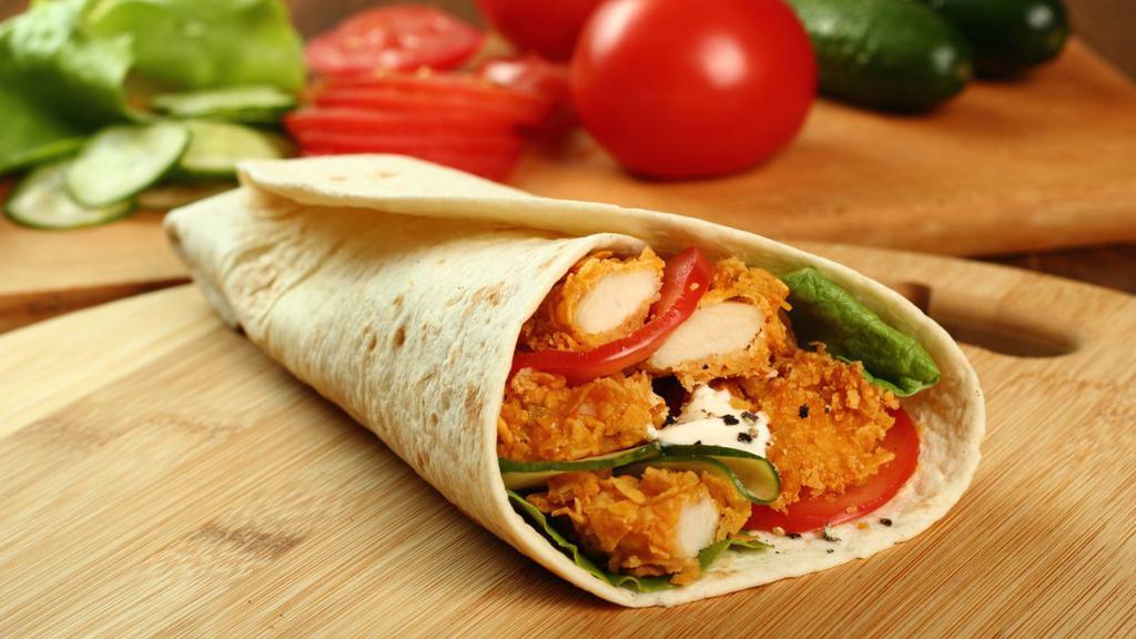 Classic Chicken Wrap · Crispy chicken with romaine lettuce, tomatoes, onions and cheese wrapped in a warm tortilla with spicy garlic sauce.