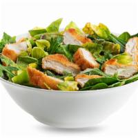 Classic Chicken Salad · Delicious chicken salad on a bed of romaine lettuce, tomatoes, onions, mixed cheeses and cro...