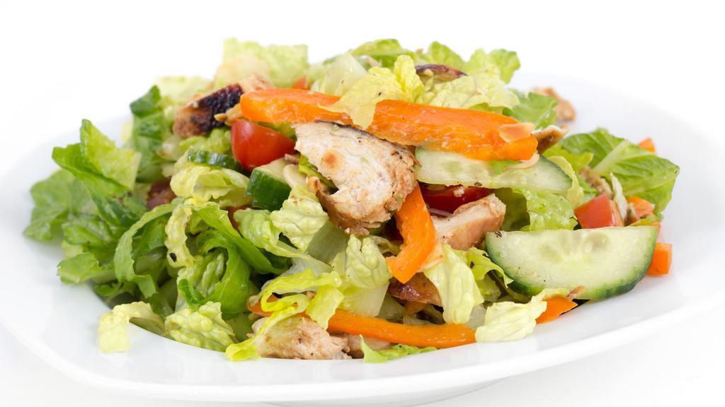 Medium Chicken Salad · Delicious medium sauce chicken salad on a bed of romaine lettuce, tomatoes, onions, mixed cheeses and croutons.