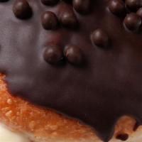 Boston Cream Filled* · Vanilla Bean Custard filled, Chocolate Glazed and topped with Chocolate Crisp Pearls.