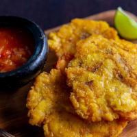 Arepas/Tostones Con Hogao · Corn Cake or Green Fry plantain with Colombian creole sauce.