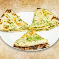 Onion Kulcha · Stuffed flatbread made with fillings of spiced onions inside a flour dough