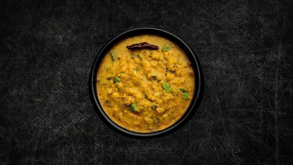 Daal Yellow Mellow (Vegan) · Yellow lentils, slow cooked to perfection and tempered with cumin, garlic and chilies, served with a side of our long grain basmati rice