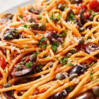 Puttanesca · Pasta Puttanesca made with tomatoes, olive oil, anchovies, olives, and capers. Add mozzarell...
