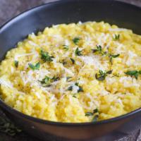 Milanese · Creamy and tasty risotto made with saffron, butter, dry white wine and parmesan cheese.