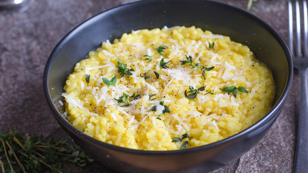 Milanese · Creamy and tasty risotto made with saffron, butter, dry white wine and parmesan cheese.