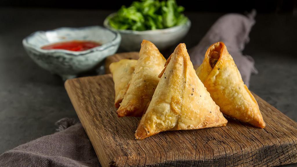 Pumpkin Samsa · A savory Central Asian pastry shaped in a bun and stuffed with seasoned pumpkin (1 piece).