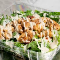 Chicken Caesar Salad · Grilled chicken, romaine lettuce, Parmesan cheese, sun-dried tomatoes, croutons, sweet peppe...